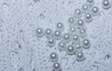 white beads on the lace openwork, hobby and creativity.