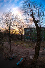 View from the window of the autumn sunset and the typical Soviet architecture of residential areas in one of the cities of Eastern Europe
