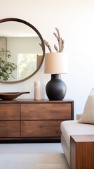Family room, walnut veneer dresser, pottery, concrete bowl, mirror leaning on the dresser, candle,
