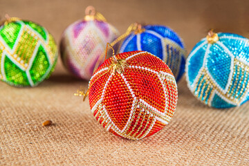 Exquisite handmade Christmas bubble toy from beads, also known as a Christmas globe or Christmas bulb, is a part of holiday decor