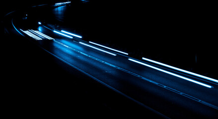 blue car lights at night. long exposure