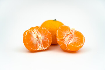 peeled tangerine on white background close up