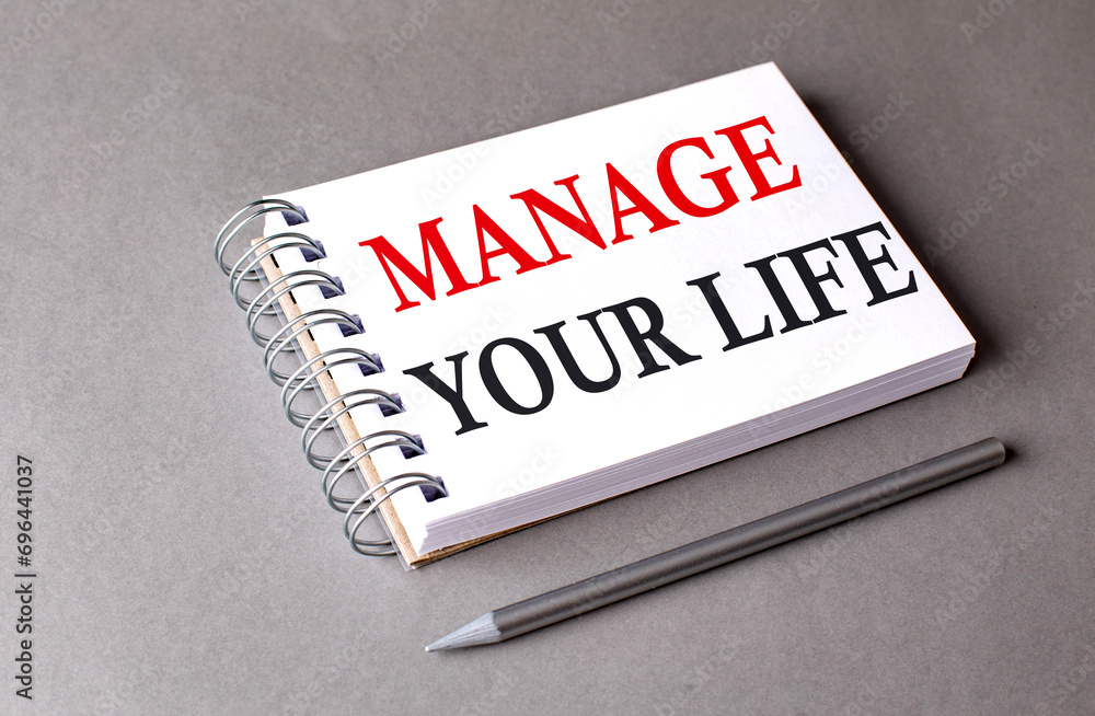 Poster manage your life word on notebook on grey background