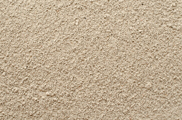 Pile of gray cement powder as a background, texture, top view. Gray cement powder, background, texture, top view.