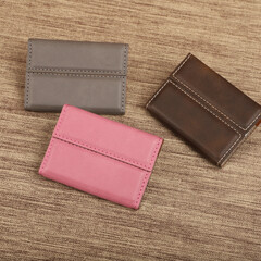 Colored leather business card holder, Genuine leather business card holder, concept shot, top view, different color, clamshell and stitched card holder