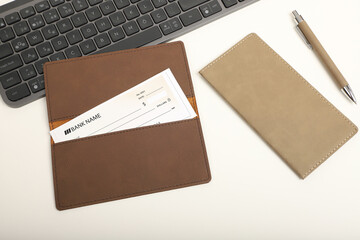 Colorful leather checkbook. Genuine leather checkbook, concept shot, top view, different color, clamshell and stitched checkbook