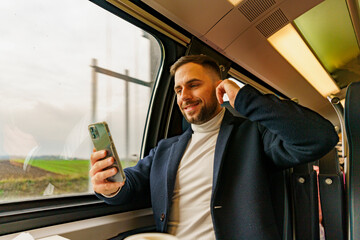 Businessman commuting by train, talking a phone discusses new project ideas