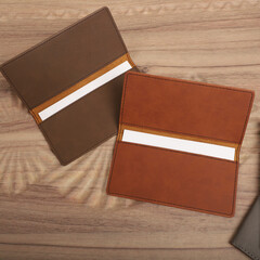 Colorful leather checkbook. Genuine leather checkbook, concept shot, top view, different color, clamshell and stitched checkbook