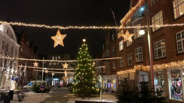 December 02, 2023: In the Storget street in central Copenhagen, Copenhagen decorated for Christmas holidays, Denmark, Viborg, Shopping street in historical center of Aarhus decorated for New Year