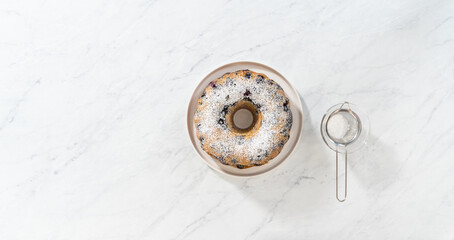 Lemon blueberry bundt cake with powdered sugar dusting