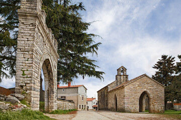 Lindar, Pazin, Istria, Croatia: the ancient church of Saint Catherine (1409) and an old arch of the...