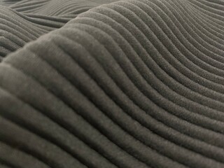 rolled pattern of fabric texture with wave surface in dark gray color