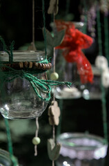 Decorative glasses on green ropes with a red bow