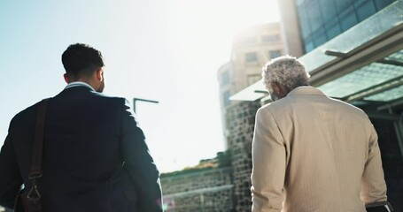 Walking, conversation and business men in the city working on a corporate legal case together. Happy, discussion and back of professional male lawyers walking and talking in the street of urban town.