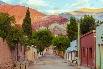 Incredible shot of a lonely street in the city of Purmamarca, Argentina with the hill of seven...