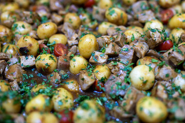 Roasted baby potato with vegetables and parsley
