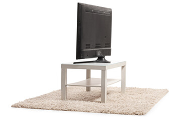 Rear view shot of a tv on a white table © Ljupco Smokovski