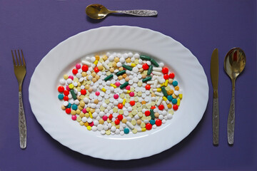 pills like food on a plate - 696492258