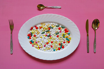 pills like food on a plate - 696492480
