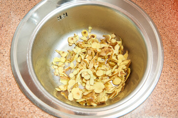 Potato peel in the kitchen sink