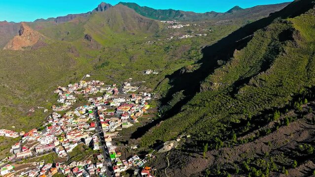 Drone view of colourful houses in Tamaimo village, Tenerife, Canary Islands. Aerial view of Tamaimo tropical, Santa Cruz de Tenerife, Spain.