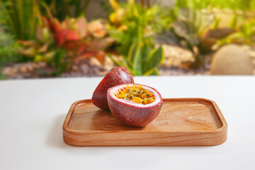 Passion fruit was cut on wooden tray
