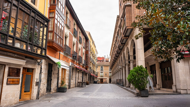 Picturesque street in the city of Valladolid with arcades in historic buildings, Spain.
