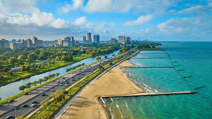 Gorgeous tourism beach, sandy coast for Chicago travel aerial beside Lake Michigan on summer day