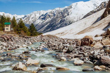Snowy mountains, mountain river. Elbrus region, Caucasus - 696503643