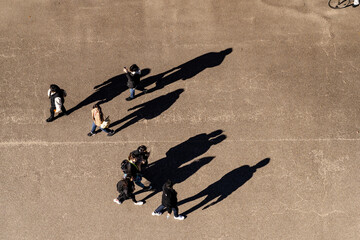 top aerial view of people walking in work time at pedestrian plaza in autumn season. with lighting...