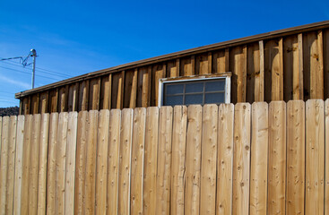 Wooden building with window and fencing