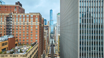 Fototapeta premium Aerial downtown skyscraper buildings, travel on railroad through big city tourism, Chicago IL