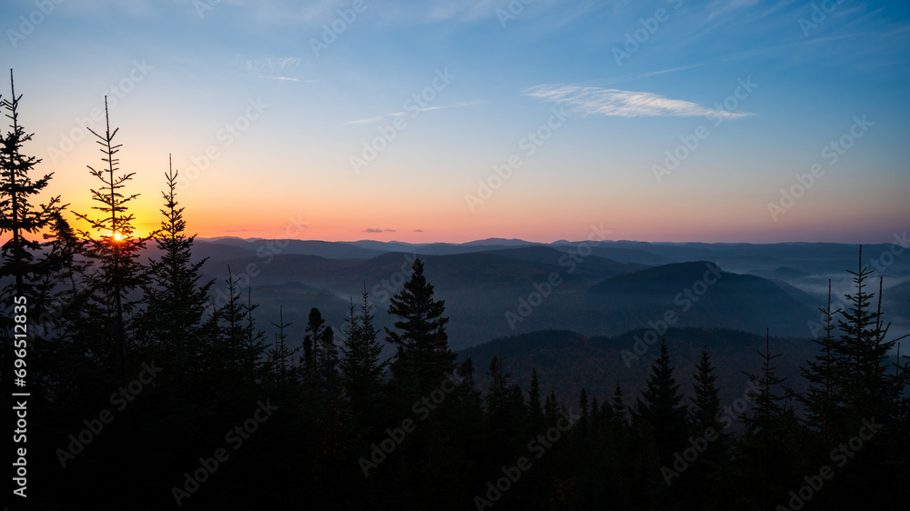 Wall mural autumn dawn over the landscape surrounding jacques cartier national park, quebec, canada