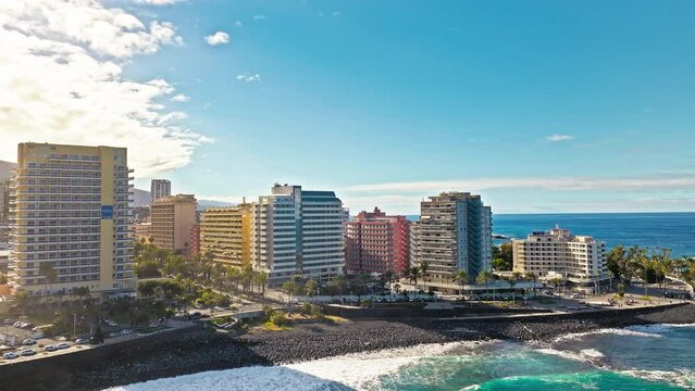 Aerial view of skyscraper buildings and colourful houses in Santa Cruz de Tenerife. Old town with modern architecture and a popular tourist destination with beaches, surf culture, historic landmarks.