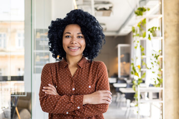 Portrait of a young successful confident African American woman, director and founder of a catering...