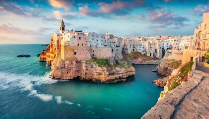 Papier Peint photo Europe méditerranéenne spectacular spring cityscape of polignano a mare town puglia region italy europe colorful evening seascape of adriatic sea traveling concept background