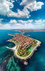 Beautiful bird's-eye night view of the old town of Nessebar, the Black Sea, Sunny Beach resort and mountains, Bulgaria.. High-altitude panoramic drone shot - obrazy, fototapety, plakaty