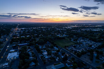 Aerial  image of Twin Falls, Idaho at sunset.  Overlooking the entire city with a beautiful sunlit sky in the background.  Shot in the summer on a drone.