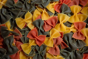 Uncooked Vibrant Colored Farfalle Pasta: A Culinary Canvas of Multicolored Bow-Tie Macaroni,...