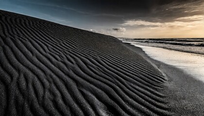 black sand dune black sand beach macro photography background texture wave pattern of oceanic sand on the beach black texture of beach sand black beach