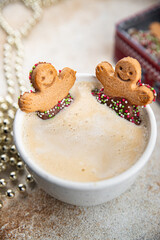 Obraz na płótnie Canvas gingerbread and a cup of hot coffee christmas cookie taste christmas sweet dessert holiday baking treat new year and christmas celebration meal food snack on the table