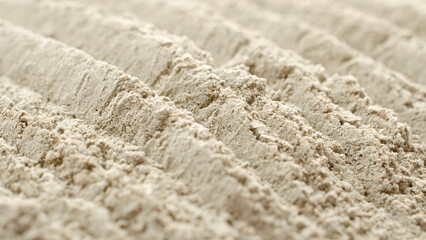 Pile of gray cement powder as background, texture, top view. Gray cement powder, background,...