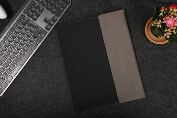 Leather and fabric flap portfolio. Concept shot, top view, flap portfolio in different colors and...