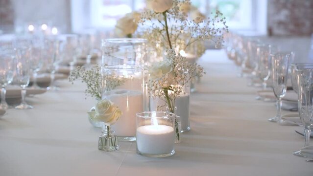 Bulk candles made of granulated wax and white decorative flowers