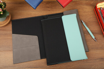 Leather and fabric flap portfolio. Concept shot, top view, flap portfolio in different colors and...