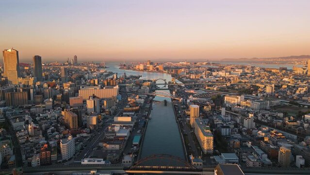 osaka city bay aerial view drone at sunrise dawn,flying over ajigawa river industrial area at dawn