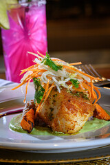 Pan Seared Chilean Sea Bass on a bed of Pea Puree and Risotto topped with Jicama Salad