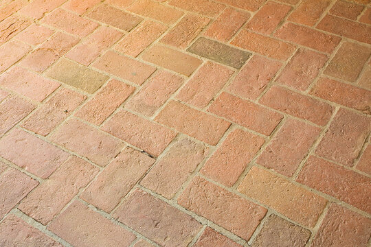 Typical old tuscany terracotta floors called a herringbone pattern due to its particular shape - Italy