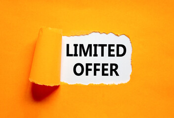 Limited offer symbol. Concept words Limited offer on beautiful white paper. Beautiful orange table...