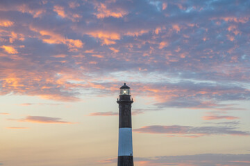 Fire Island Lighthouse sunset sky. Colorful cloudscape with vibrant clouds. Fire Island Lighthouse...